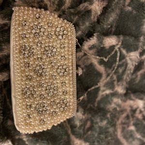 bejeweled clutch with small metal strap